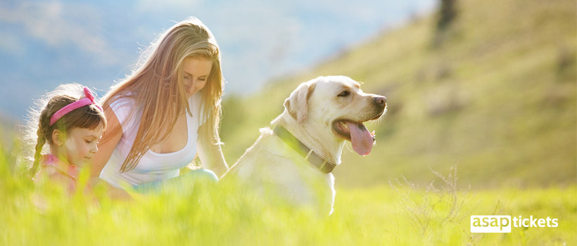 Dog outside with a girls - ASAPtickets Travel Guide | Pet Quarantine Australia