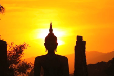 Buddha with temples in sunset - ASAPtickets travel blog