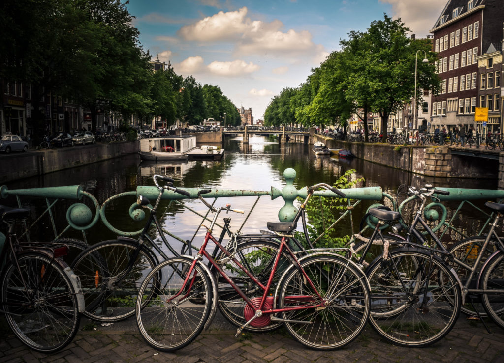 Valentines Day Vacation Ideas - Amsterdam canal with bicycles - ASAP Tickets Travel Blog